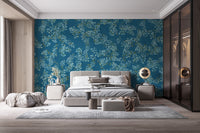 Blue Floral peel and stick wallpaper in deep blue with white blooms behind an upholstered bed in a modern bedroom