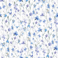 Elegant guest room featuring oversized blue floral prints in a sunlit space.