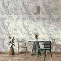 Delicate golden butterflies scattered on a light background.

