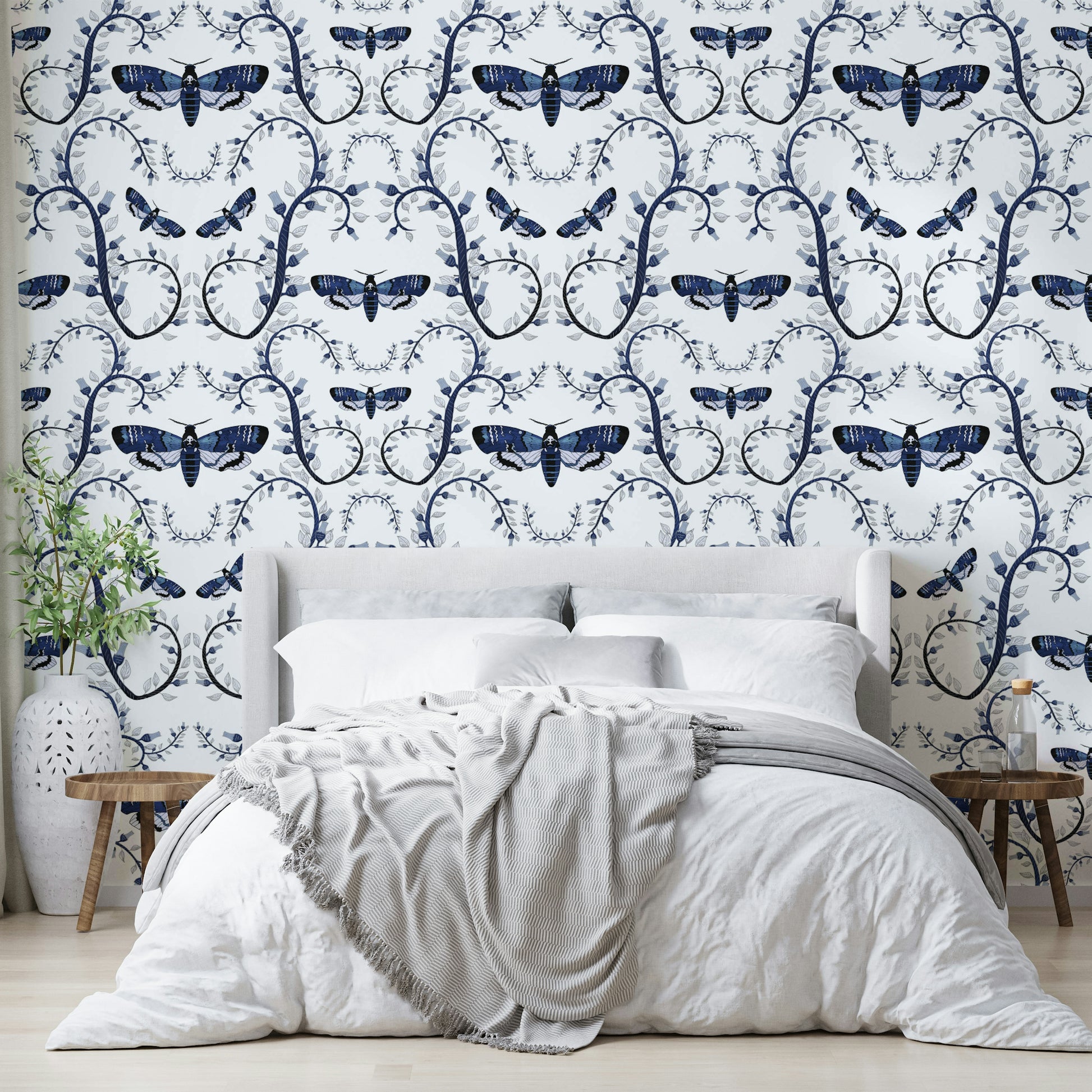 Moody blue wallpaper with gothic insect details

