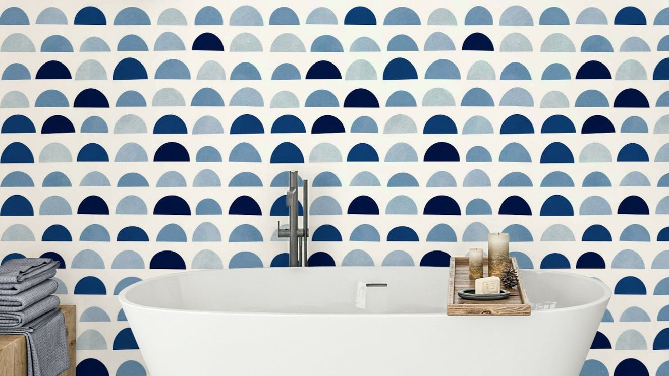 A modern wall mural with a repeating pattern of half-moon shapes.

