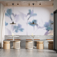 Blue Orchids Foggy wallpaper mural as a bedroom feature wall behind the headboard in blue tones
