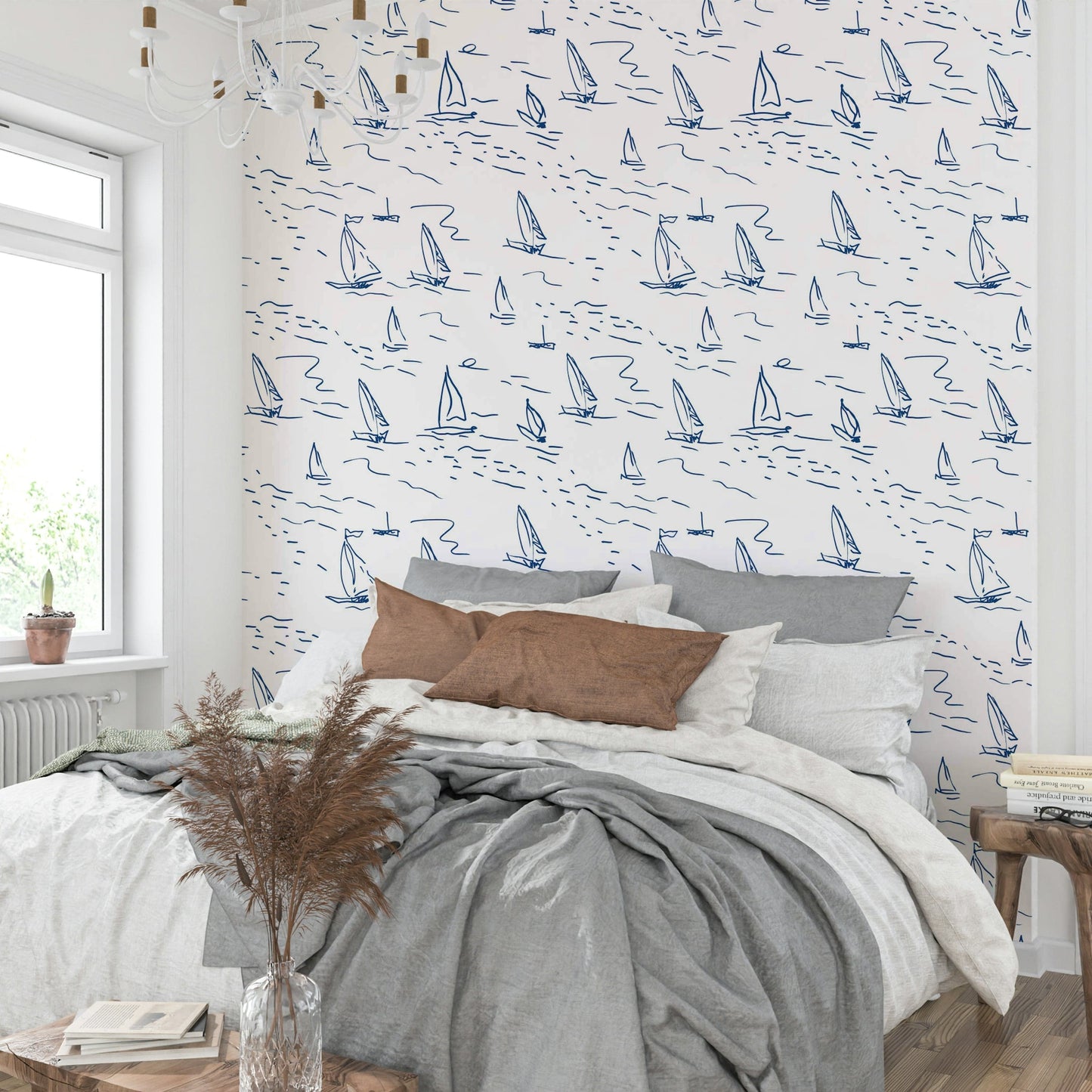 An angled shot of a wall with sailboat wallpaper


