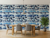 Calming guest room featuring Blue Tide Wallpaper paired with soft grey textiles.