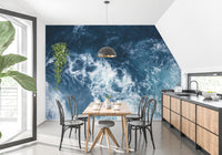 Blue Water wallpaper mural styled along a hallway feature wall near a console in blue tones
