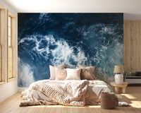Blue Water wallpaper mural styled as a feature wall behind a dining table and chairs in blue tones