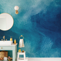 Blue Watercolor Liquid Paint wallpaper mural styled as a feature wall behind a dining table and chairs in blue tones