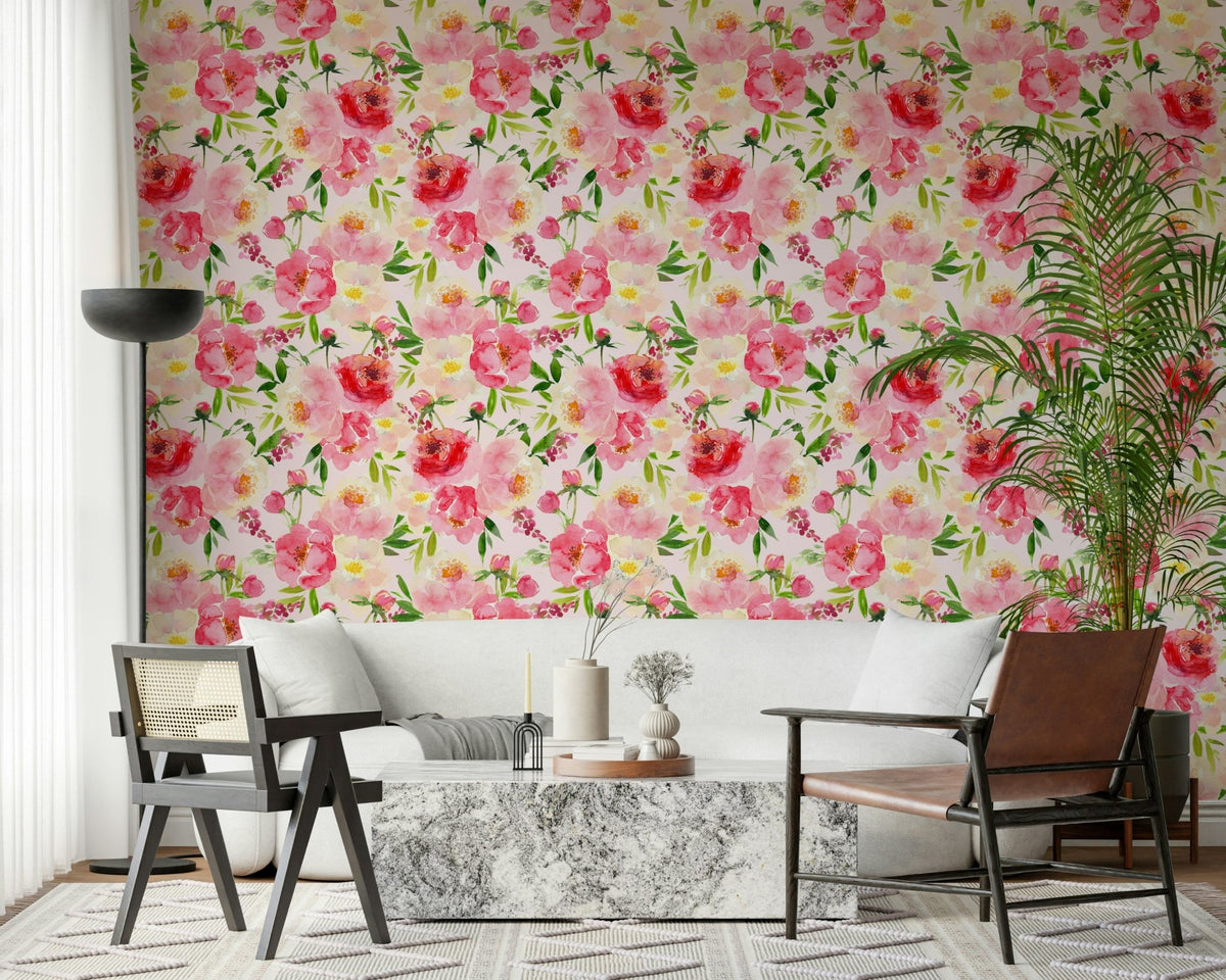 Blush Bloom Watercolor wallpaper behind a white sofa and caned chair with a marble coffee table