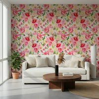 Blush Bloom Watercolor wallpaper behind a cream sofa and round walnut coffee table in a living room