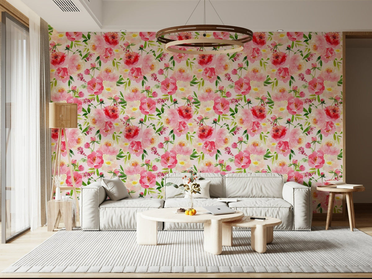 Blush Bloom Watercolor wallpaper behind a cream sofa under a round wood ring pendant in a living room