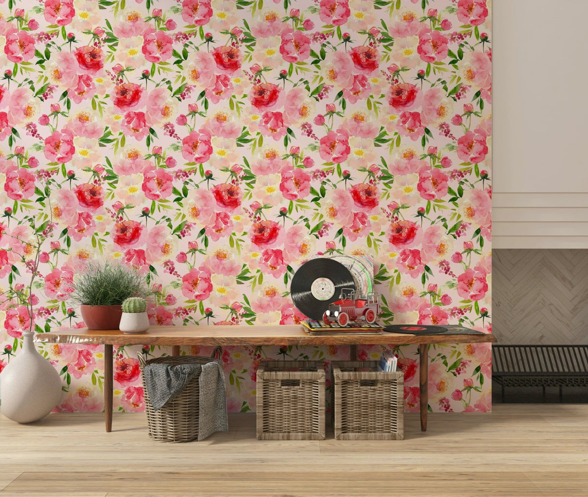 Blush Bloom Watercolor wallpaper above a wood console with vinyl records and woven baskets in an entryway