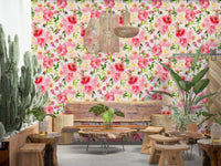 Blush Bloom Watercolor wallpaper behind a live-edge wood bench and woven pendant lights in a lounge