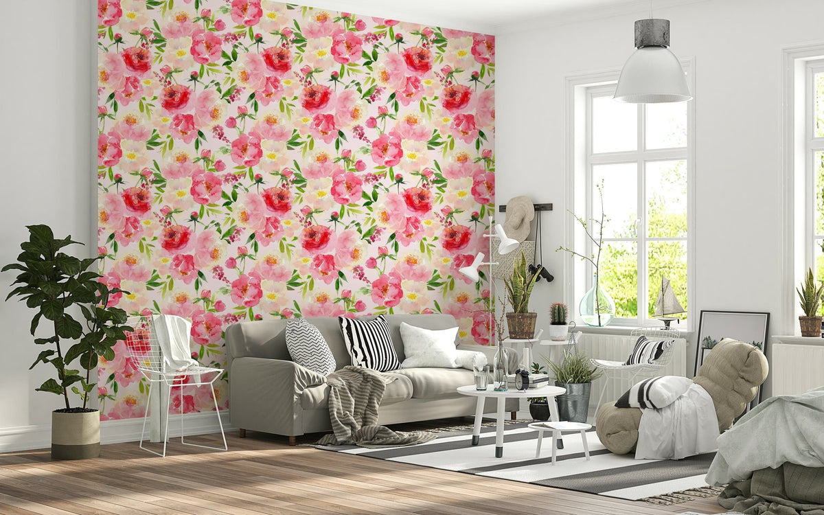 Blush Bloom Watercolor wallpaper behind a grey sofa and white wire chair in a bright living room