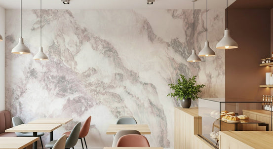 Blush Marble Elegance wallpaper mural in a cafe with wood tables, pastel chairs and a pastry display case