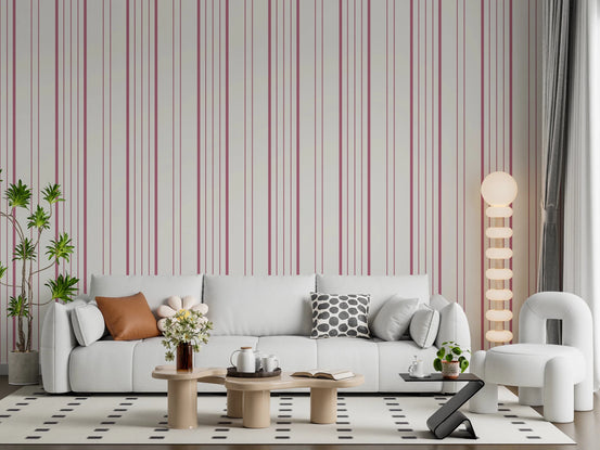 Blush Stripes wallpaper in a living room with white sofa, boucle chair and globe floor lamp