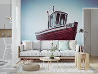 Weathered Boat Resting on Pebbled Strand wall mural, fishing boat, pebble beach.