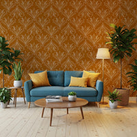 Boho Art Nouveau Folk Floral Mustard Gold wallpaper behind a teal-blue sofa with yellow cushions in a living room