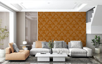 Boho Art Nouveau Folk Floral Mustard Gold wallpaper behind a grey sectional and tan chaise in a living room