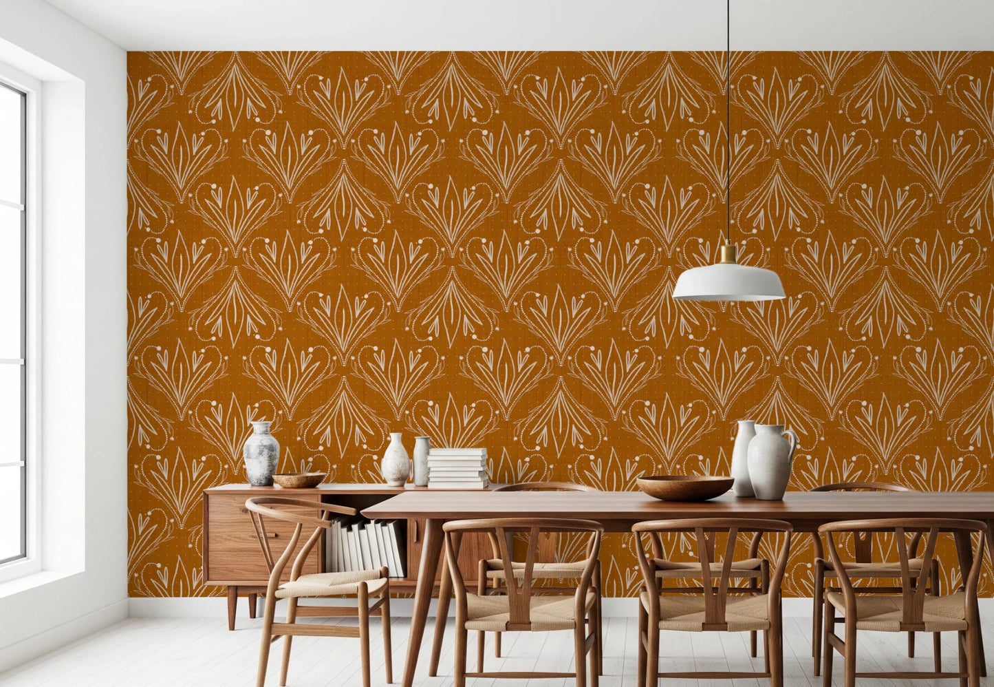 Boho Art Nouveau Folk Floral Mustard Gold wallpaper behind a wood dining table and wishbone chairs in a dining room