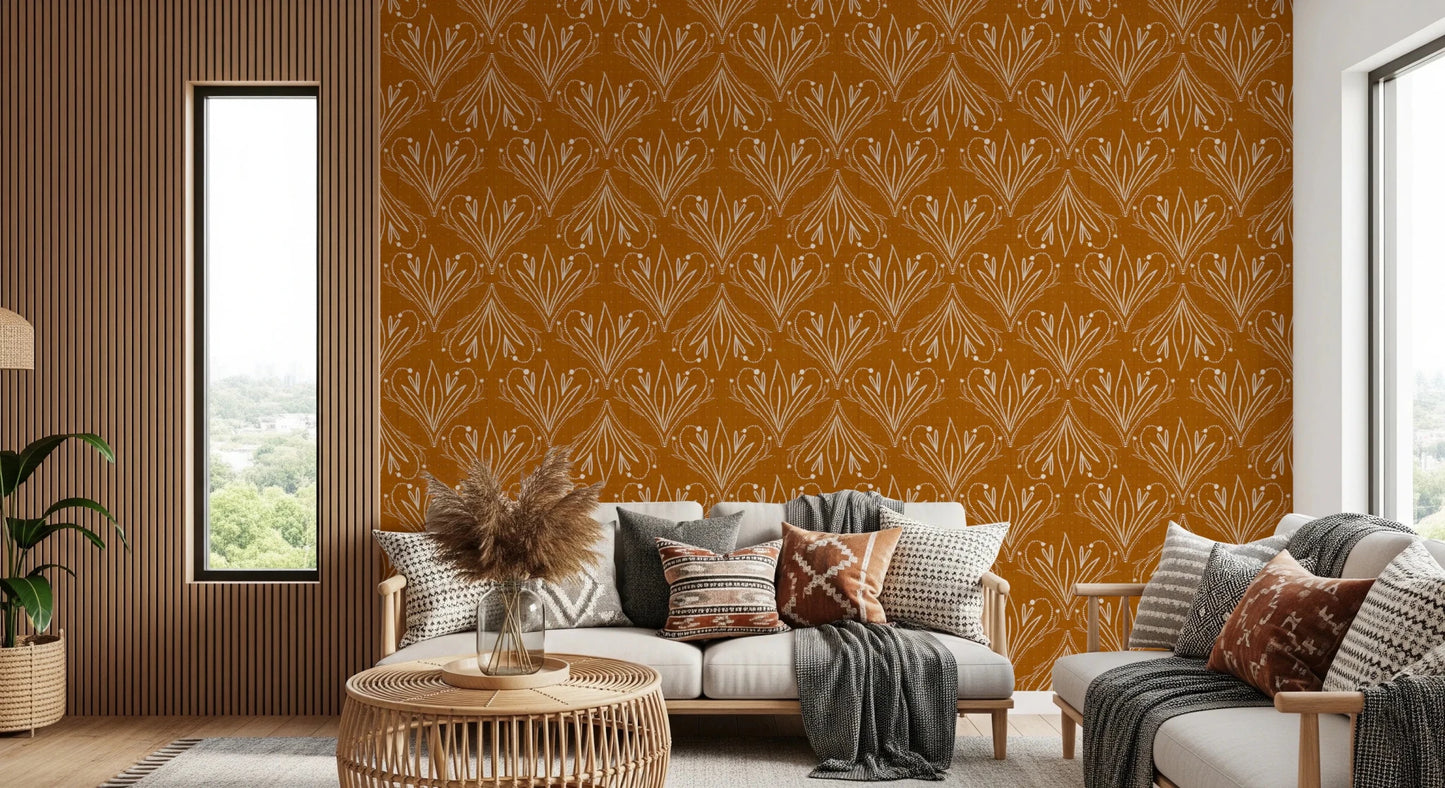 Boho Art Nouveau Folk Floral Mustard Gold wallpaper behind a cream sofa with grey throws in a living room