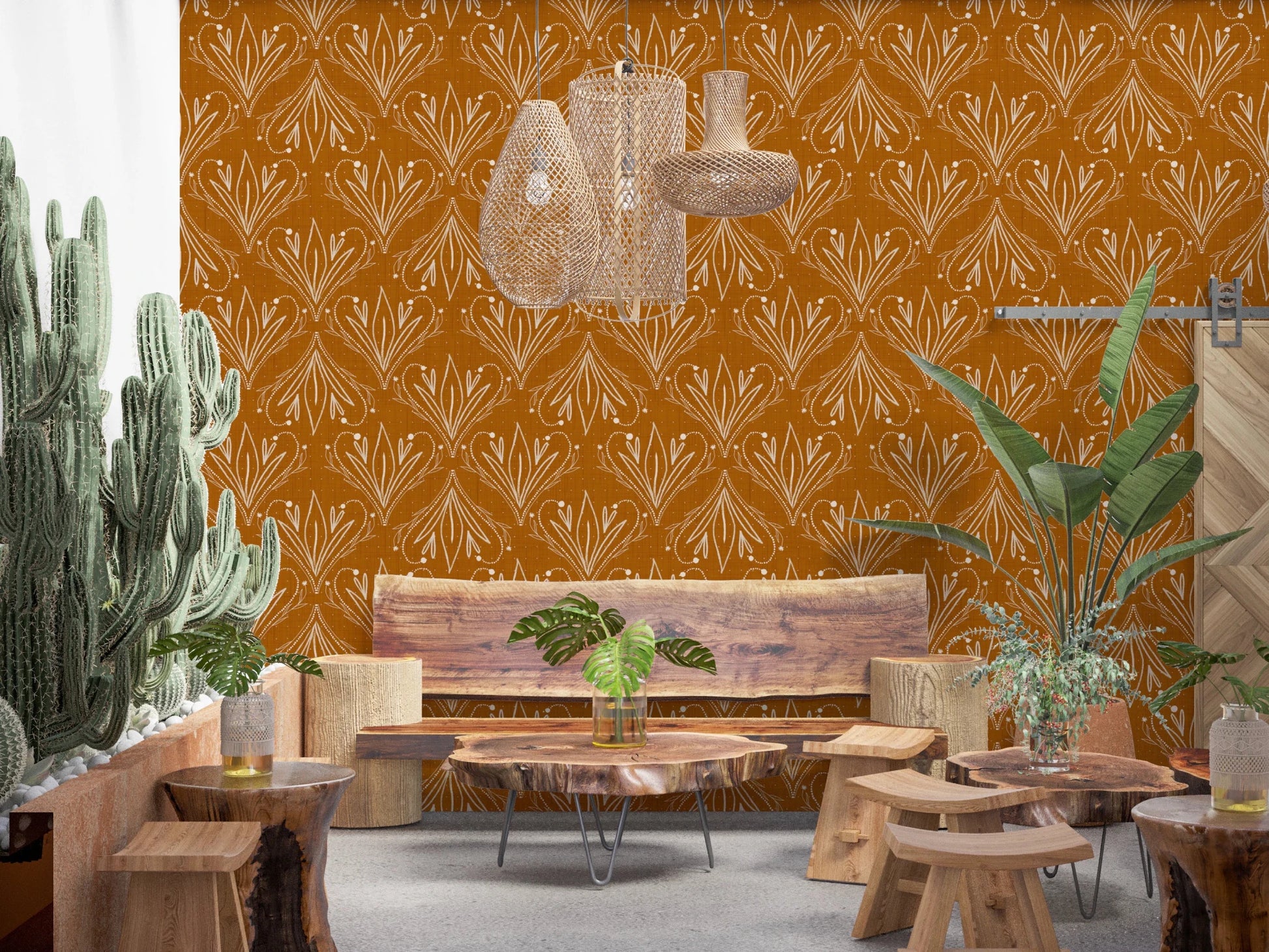 Boho Art Nouveau Folk Floral Mustard Gold wallpaper in a lounge with tall cacti and live-edge wood furniture