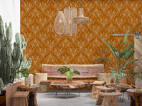 Boho Art Nouveau Folk Floral Mustard Gold wallpaper in a lounge with tall cacti and live-edge wood furniture