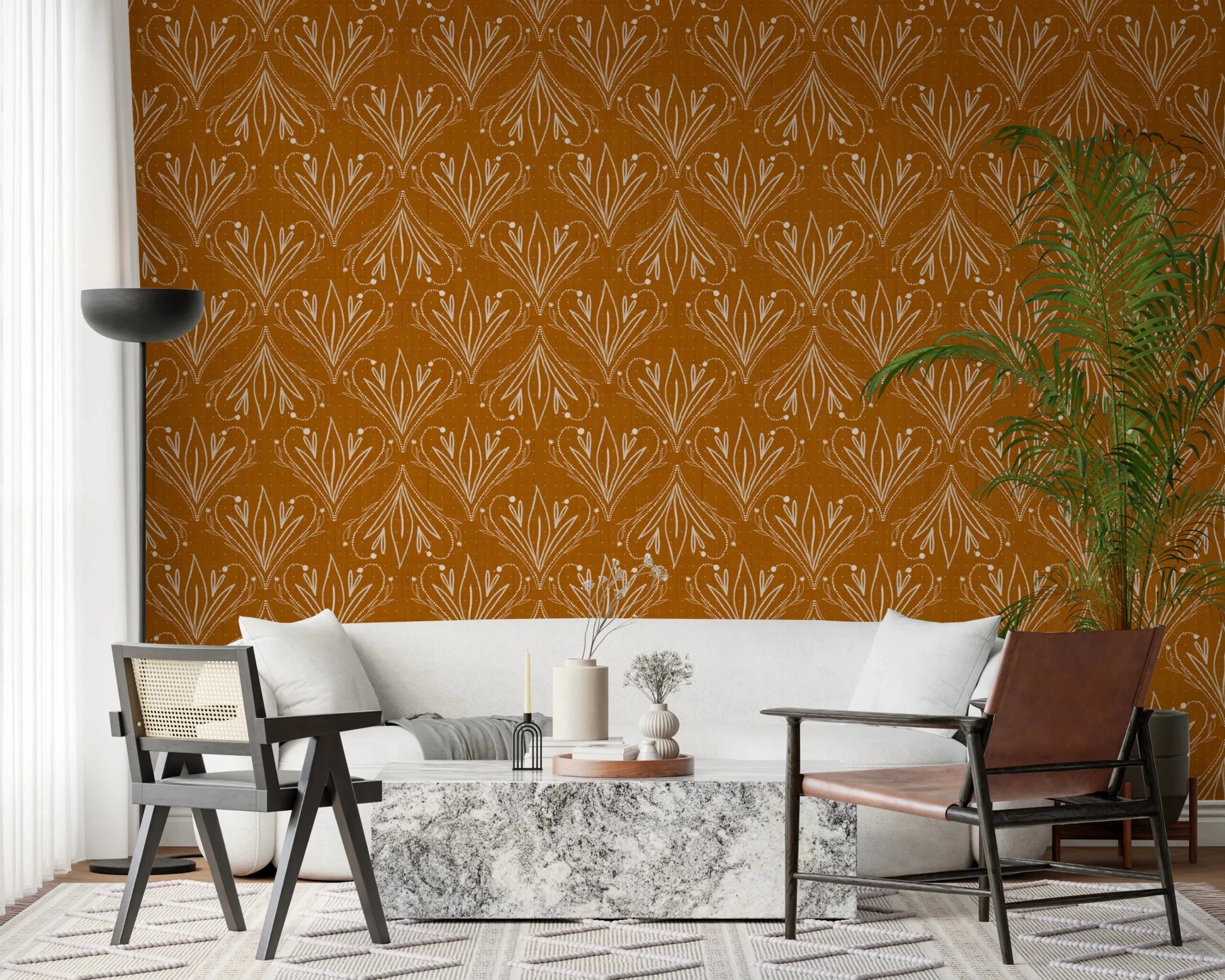 Boho Art Nouveau Folk Floral Mustard Gold wallpaper behind a cream sofa and marble table in a living room