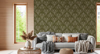 Boho Art Nouveau Folk Floral Olive Green wallpaper behind a grey sofa with boho cushions in a living room