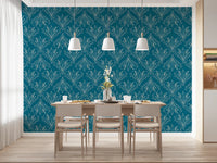 Boho Art Nouveau Folk Floral Teal Blue wallpaper behind a light wood dining table and pendant lights in a dining room