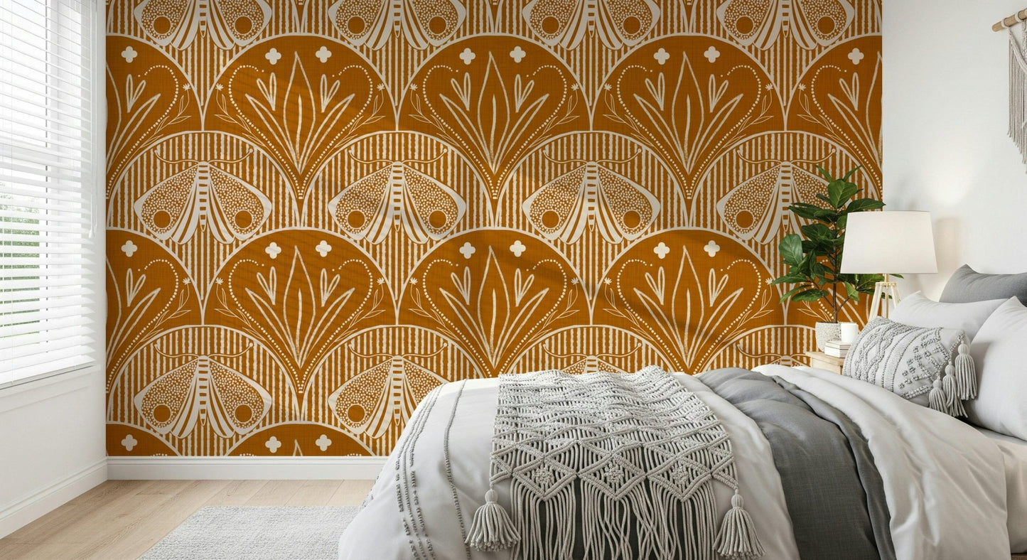 Boho Art Nouveau Scallop Butterfly Floral in Burnt Orange wallpaper mural behind a bed with a macrame throw