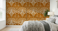 Boho Art Nouveau Scallop Butterfly Floral in Burnt Orange wallpaper mural behind a bed with a macrame throw