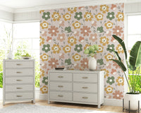 Soft pastel floral motifs arranged in a playful bohemian pattern across this charming wallpaper.