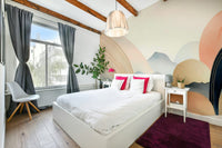 Soft sky-inspired wall mural with calming hues


