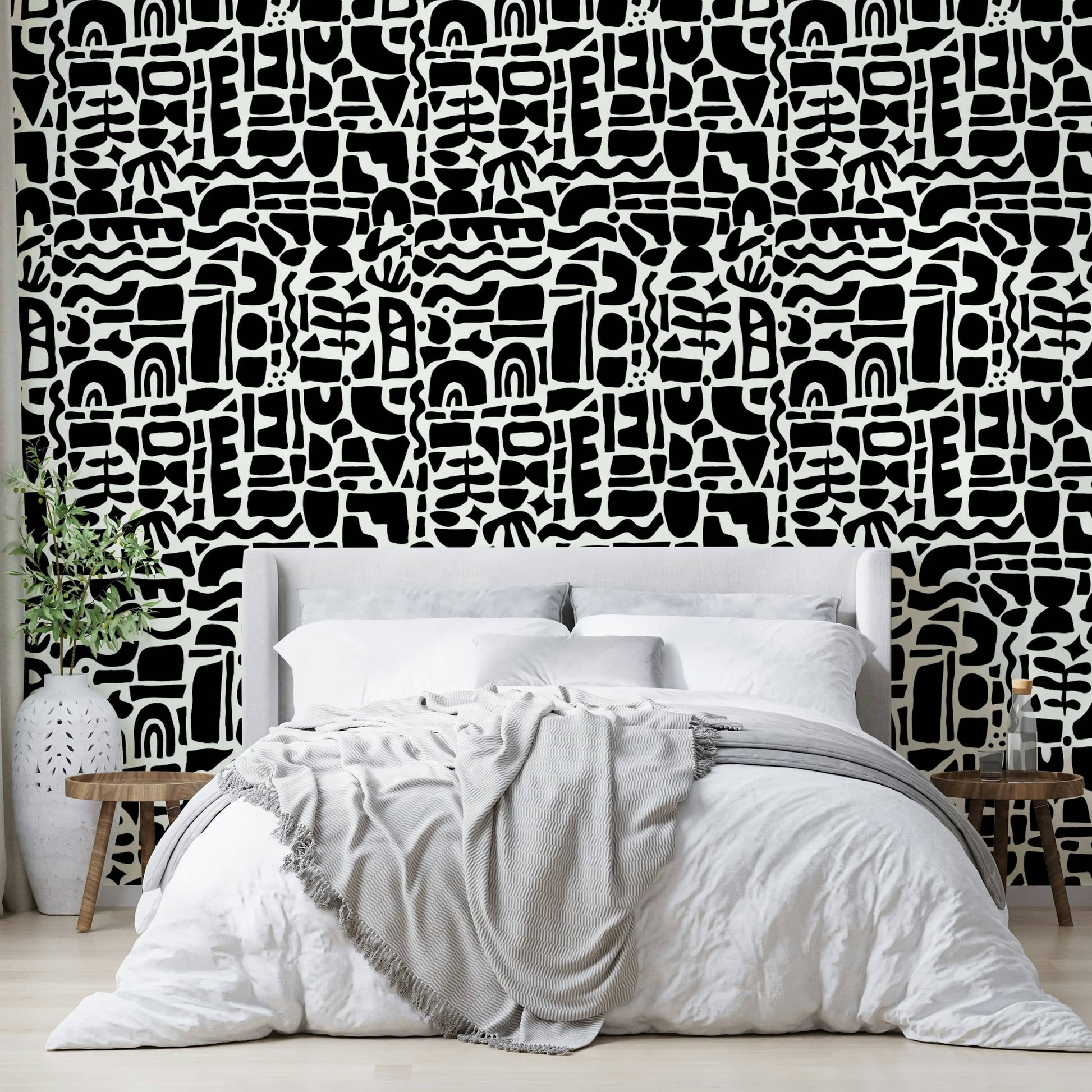 The design is an abstract collage of overlapping shapes.
