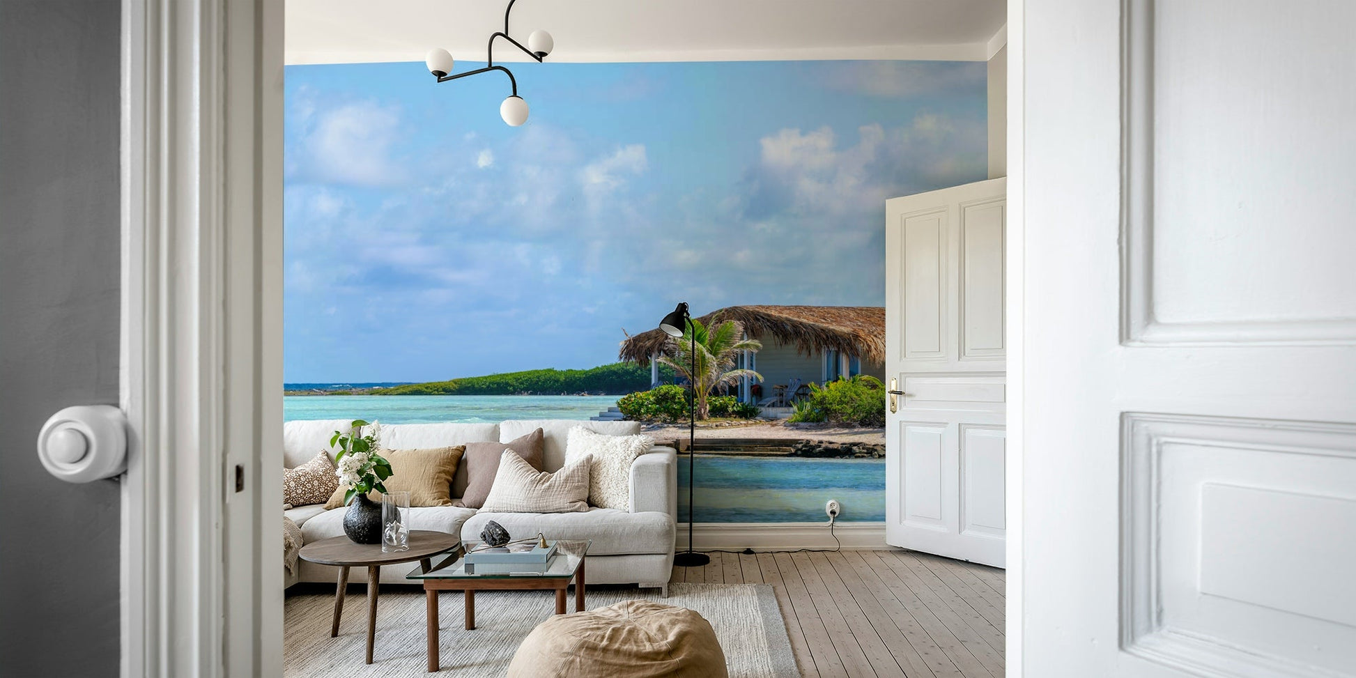 Wall mural featuring a small building with a thatched roof.

