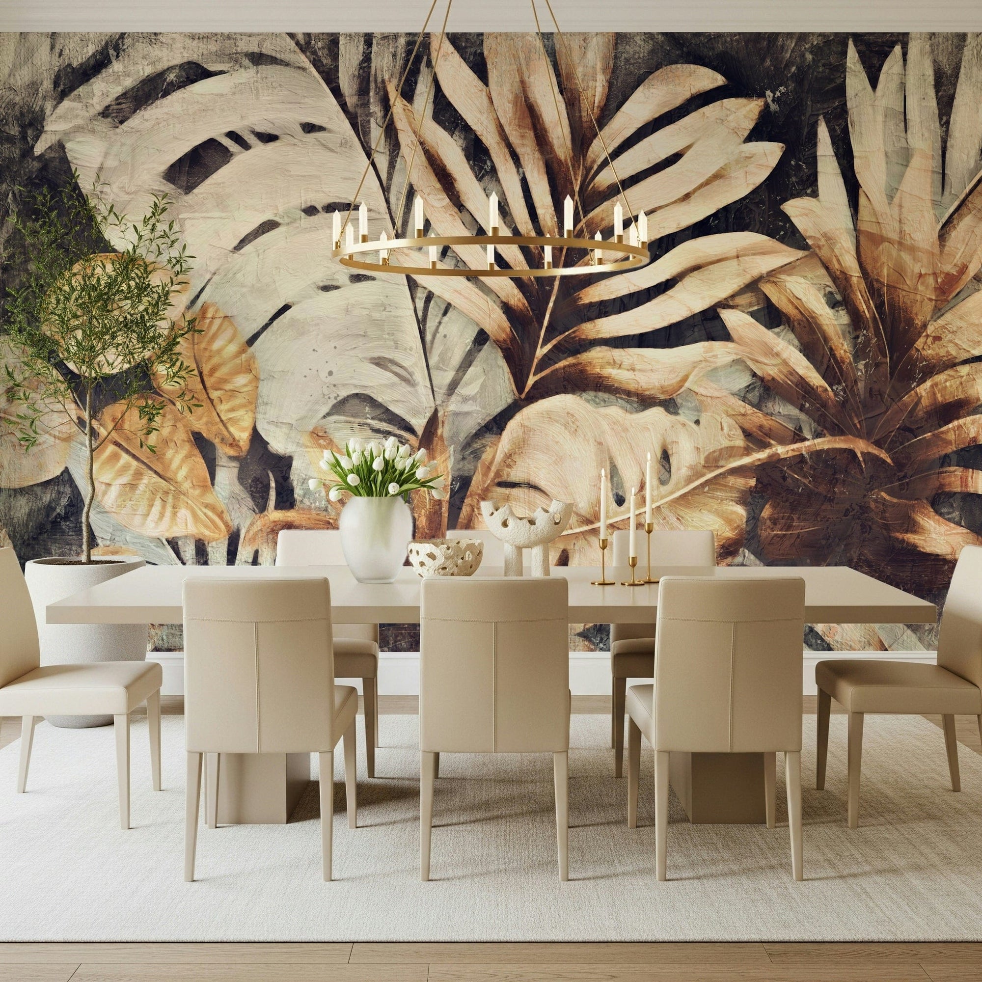 Botanical Echo wallpaper mural of painterly tropical leaves in warm browns behind a beige dining table under a brass ring chandelier