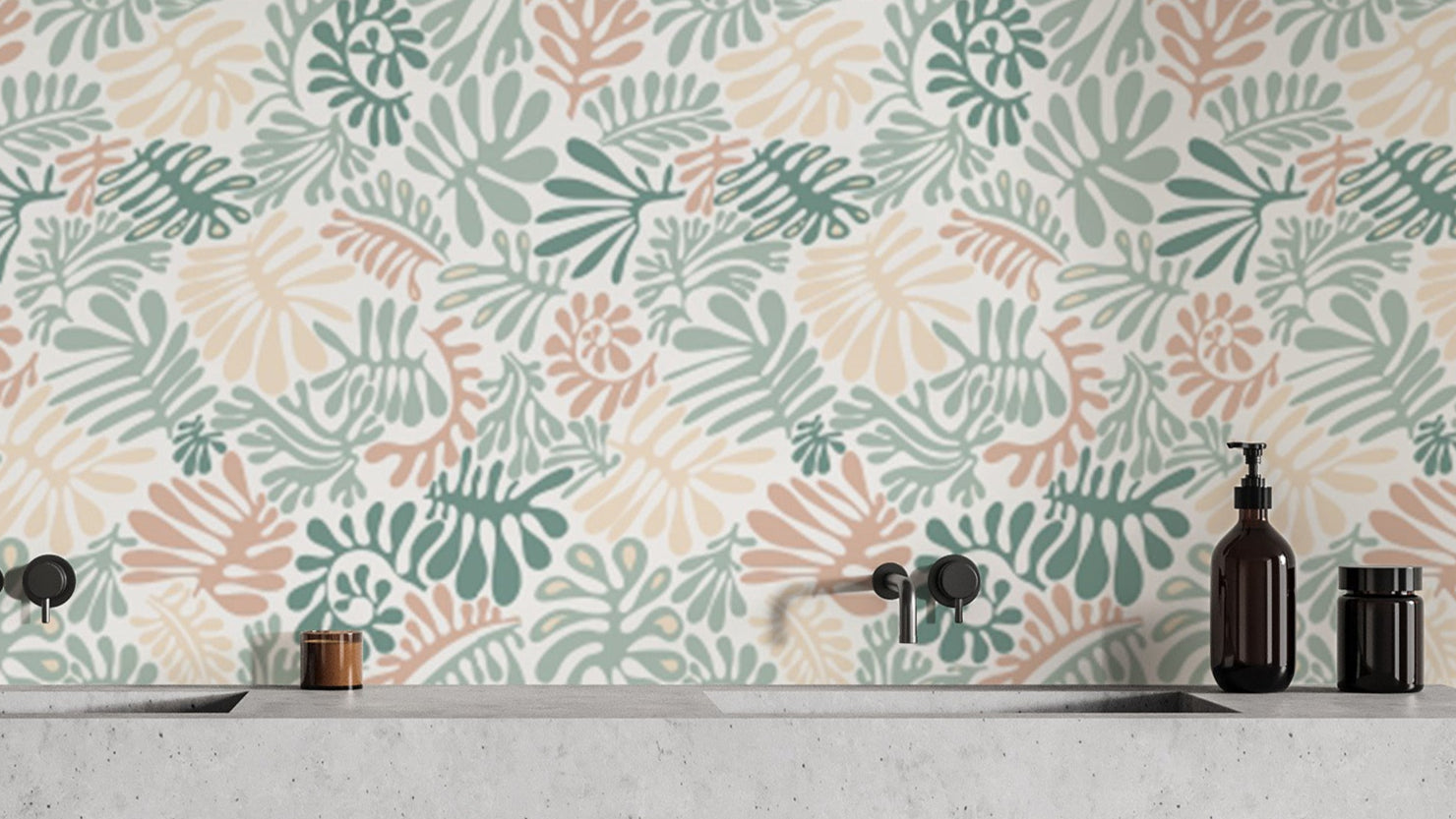 Botanical Elegance wallpaper of sage green and blush leaf shapes above a concrete vanity and black taps in a bathroom