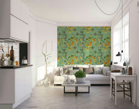 An artistic flying bird mural on lush wallpaper.

