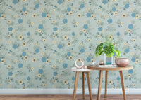 Sophisticated pastel blue wallpaper with scattered floral motifs.
