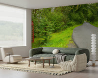 Panoramic mural of a remote asphalt road and a striking cultural landmark. British Call Box.