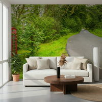 Charming wall mural featuring an isolated red kiosk amidst dense shrubs. Call Box design.