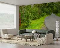 Panoramic mural of a remote asphalt road and a striking cultural landmark. British Call Box.