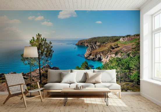 Coastal view on Brittany Vista Wall Mural, calm ocean wallpaper with green color foreground