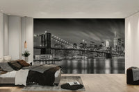 Calm water reflections under illuminated bridge mural wallpaper

