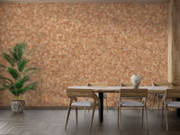 Brown Color Autumn Leaves wallpaper mural in orange behind a wooden dining table and chairs with a potted palm