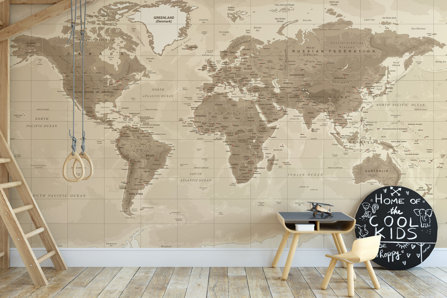 Brown Detailed Worldmap wall mural in beige tones behind gym rings and a small play table in a kids playroom