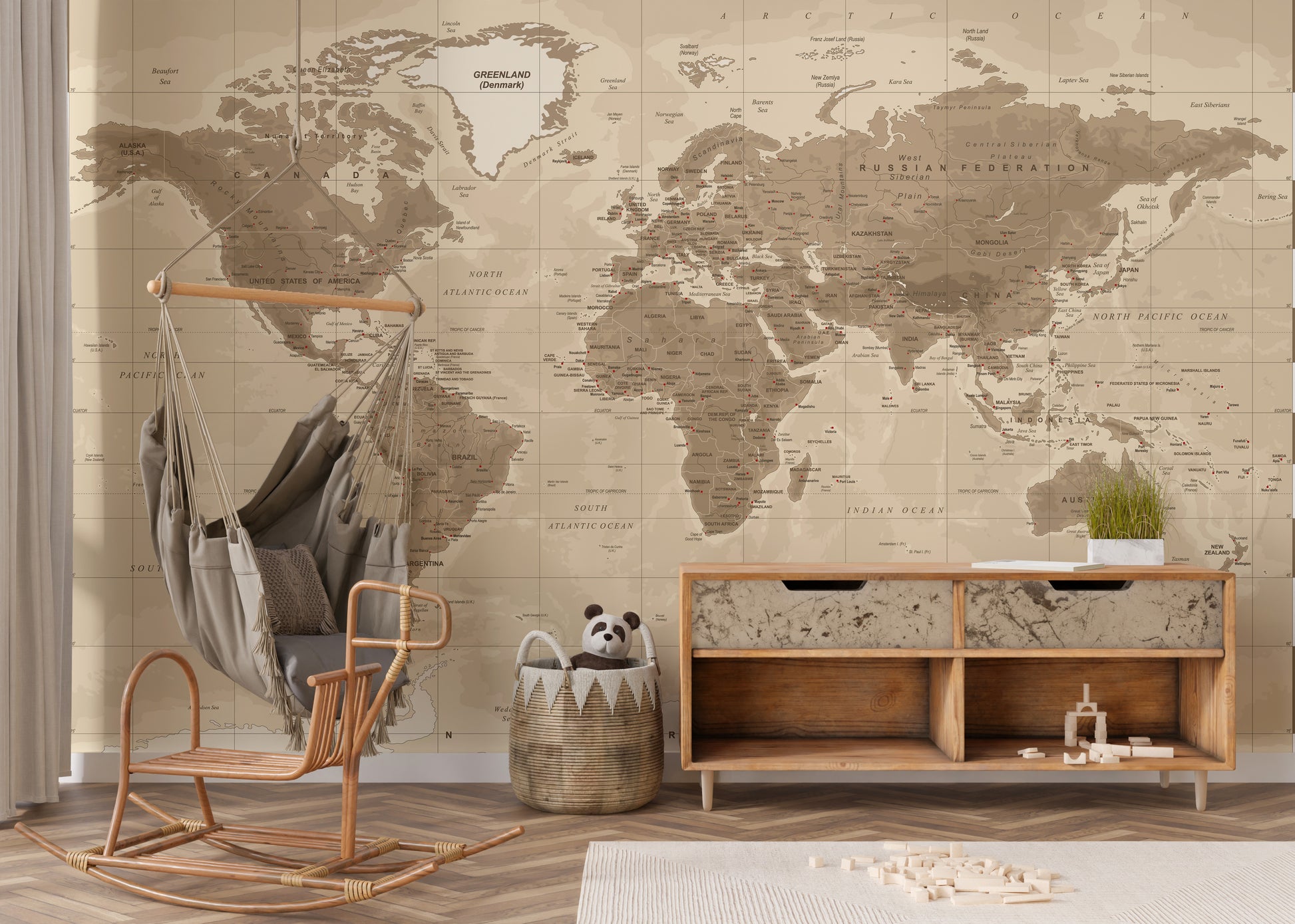 Brown Detailed Worldmap wall mural in sepia tones behind a rattan swing chair and wooden sideboard in a kids room