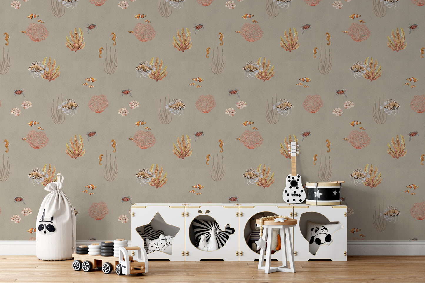 Brown Oceanic Wonders wallpaper behind a white toy cabinet with a guitar and toy drum