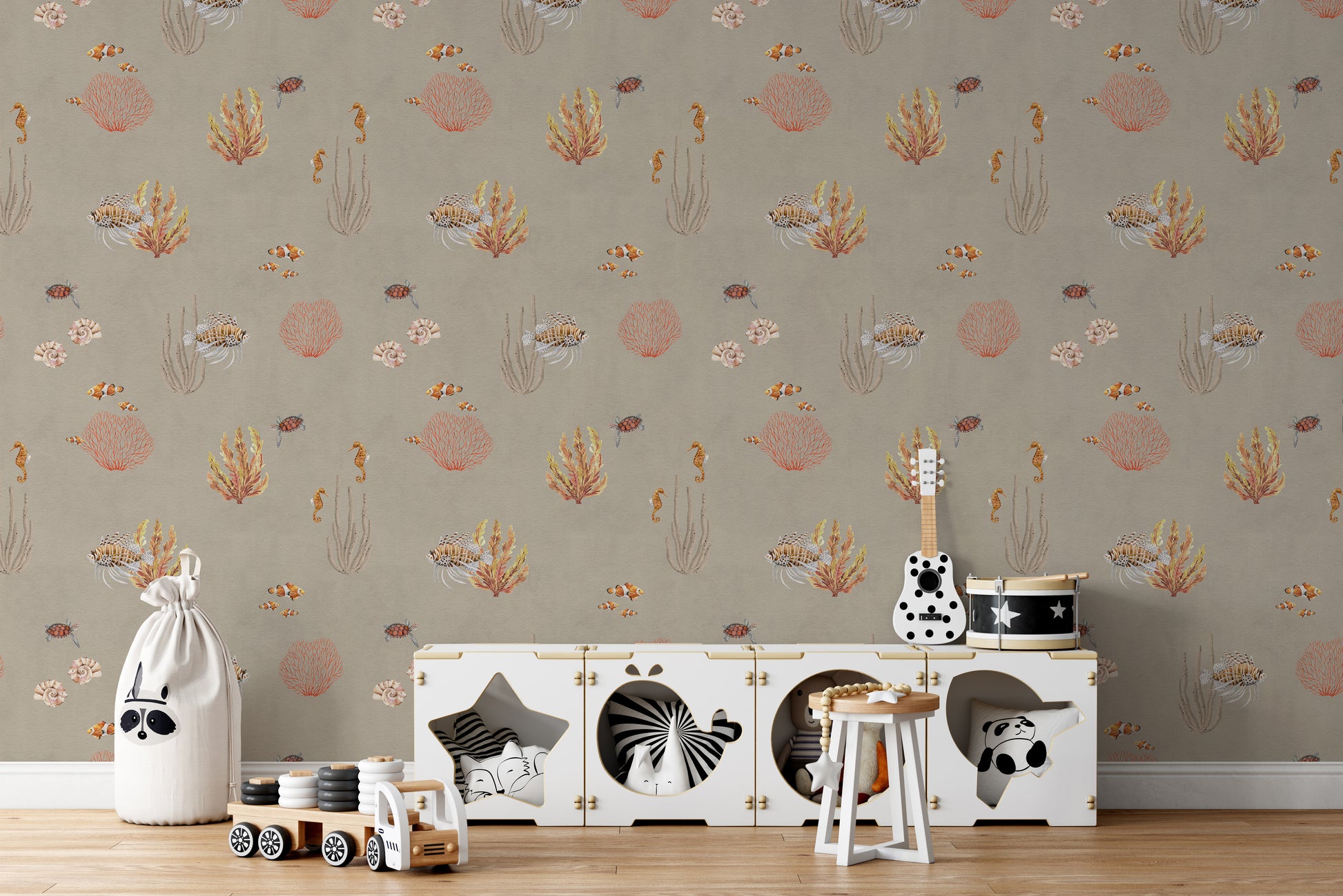 Brown Oceanic Wonders wallpaper behind a white toy cabinet with a guitar and toy drum