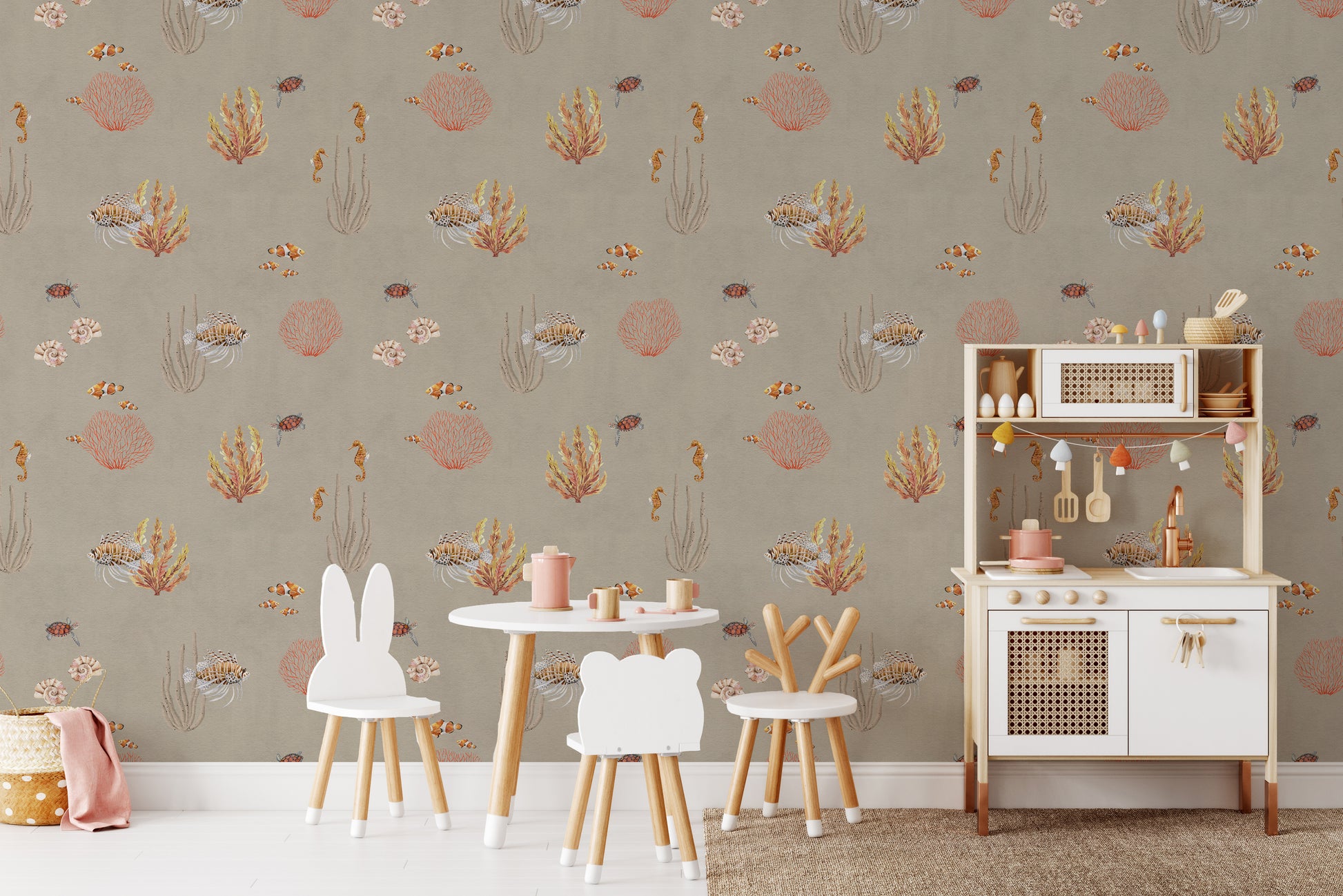 Brown Oceanic Wonders wallpaper beside a white play kitchen and bunny chairs in a kids room